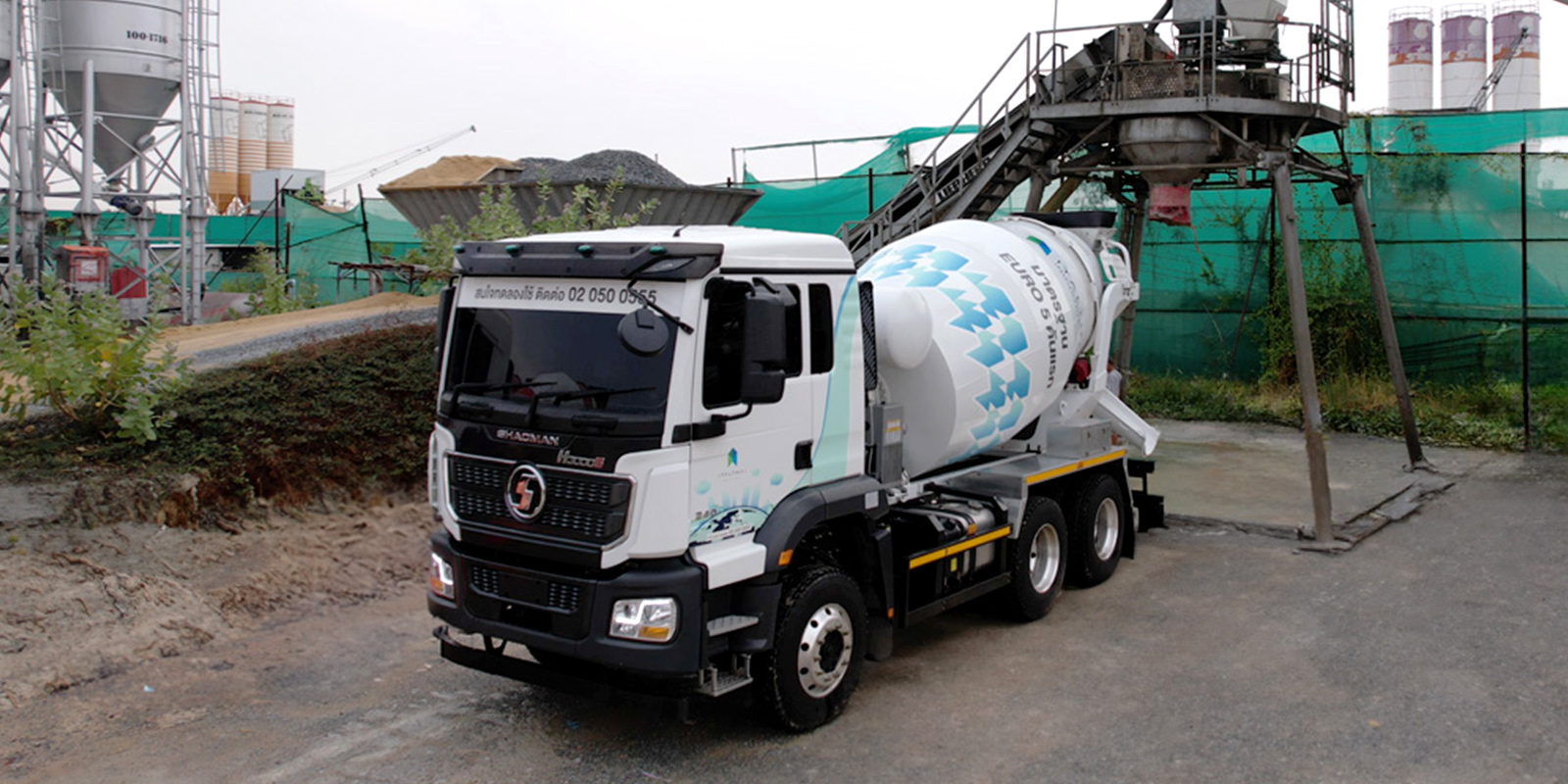 The Shacman concrete mixer truck